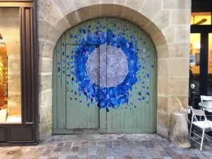 Street art on doors in Marais Paris