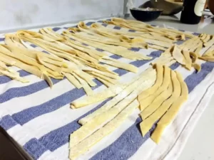 Drying home made pasta on the table