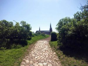 Old paved road and view on Roskilde Cathedral