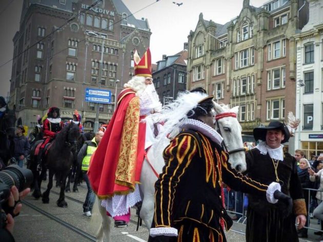 Sinterklaas on a white horse in Amsterdam