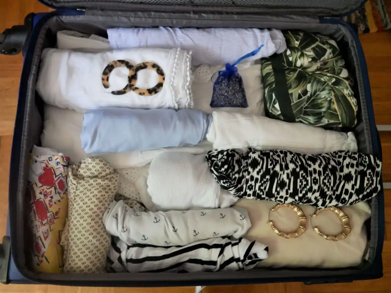 Rolling the clothes inside the suitcase