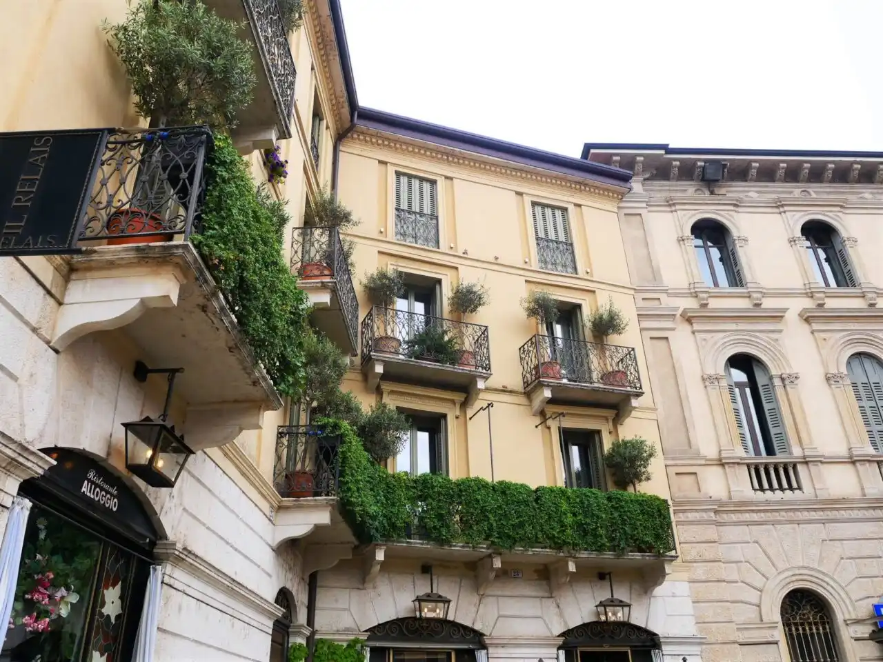 Facades and balconies with plants on them in Verona