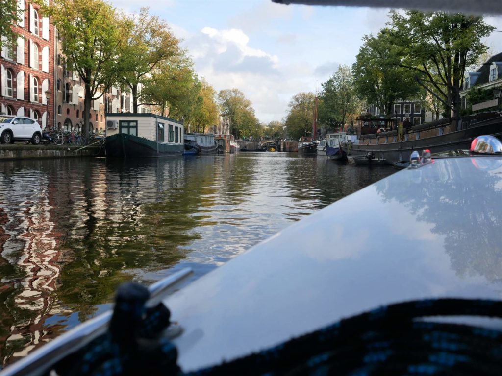 Photo of Amsterdam canal from a small boat