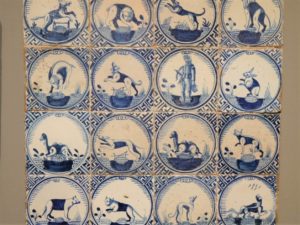 Historical white tiles with blue images of animals on them