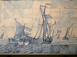 Historical tile tableau with an image of Dutch ship on them