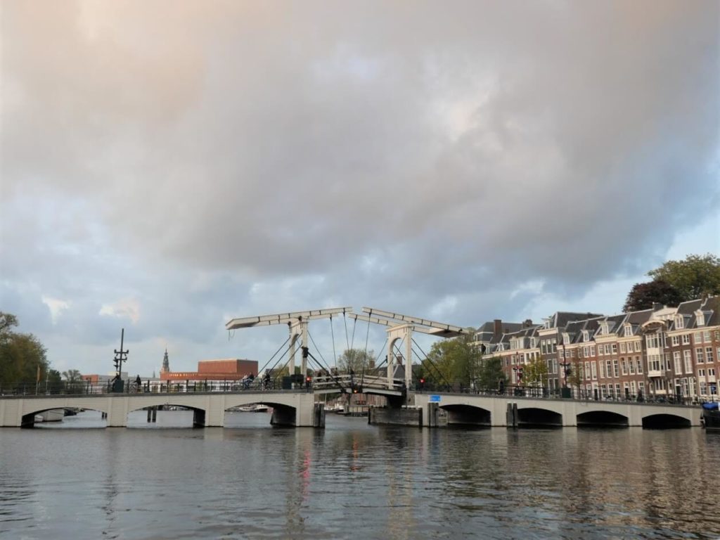 White bridge crossing the river Amstel in Amsterdam