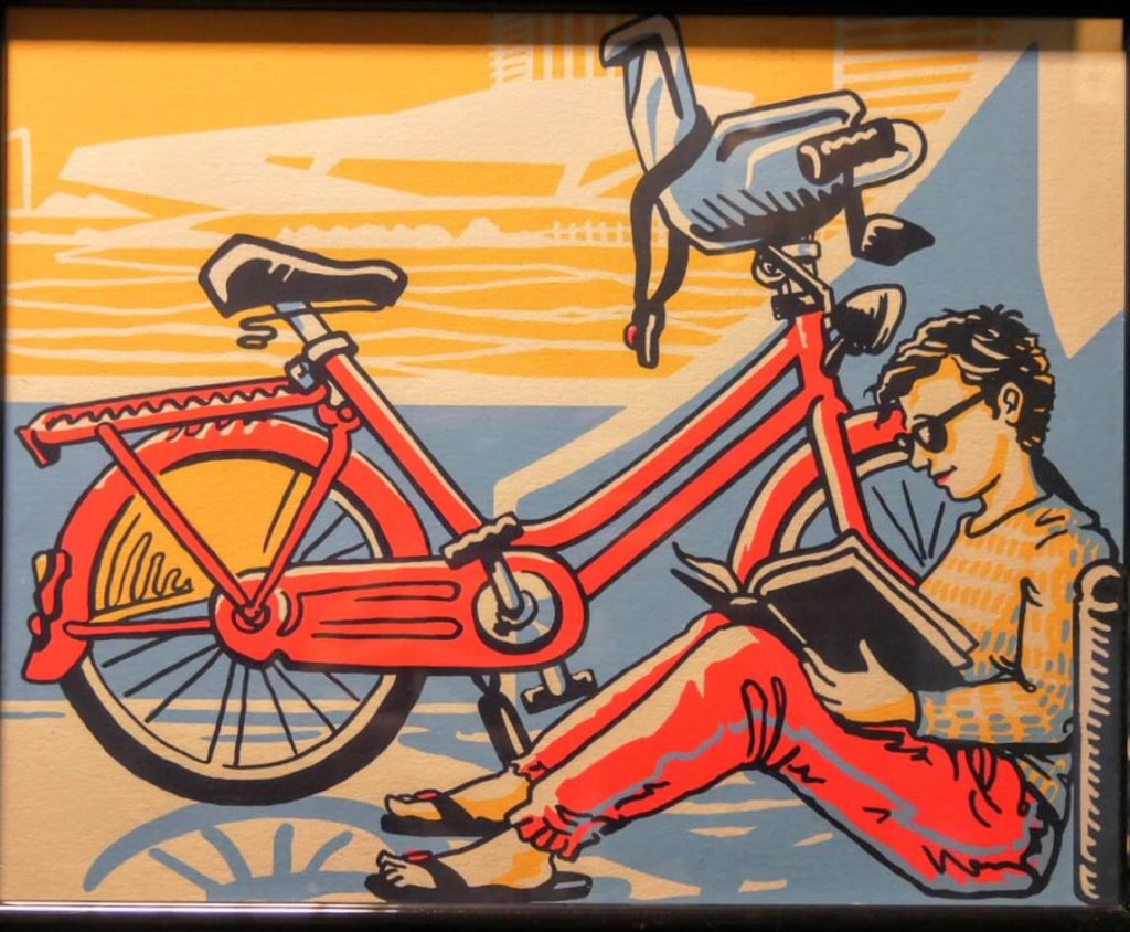 Illustration of a man reading a book on a ferry