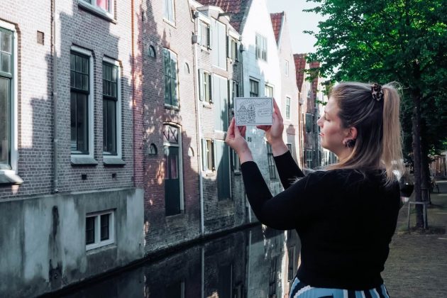 Tea with her colouring postcards in Alkmaar