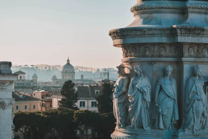 View on Rome. Statues in the closeup on the right.