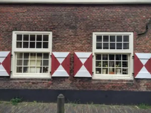 Nice old red windows on old building in Haarlem